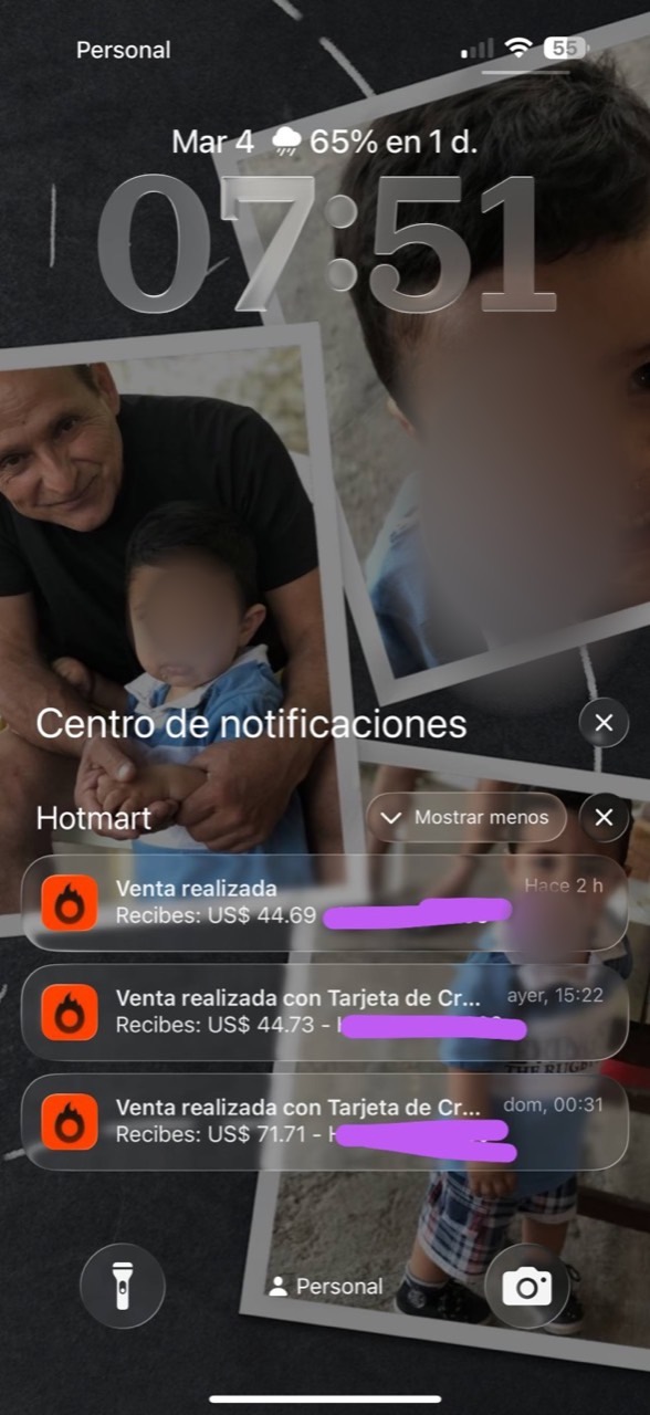 Pantalla de bloqueo de un móvil con tres avisos de venta de Hotmart